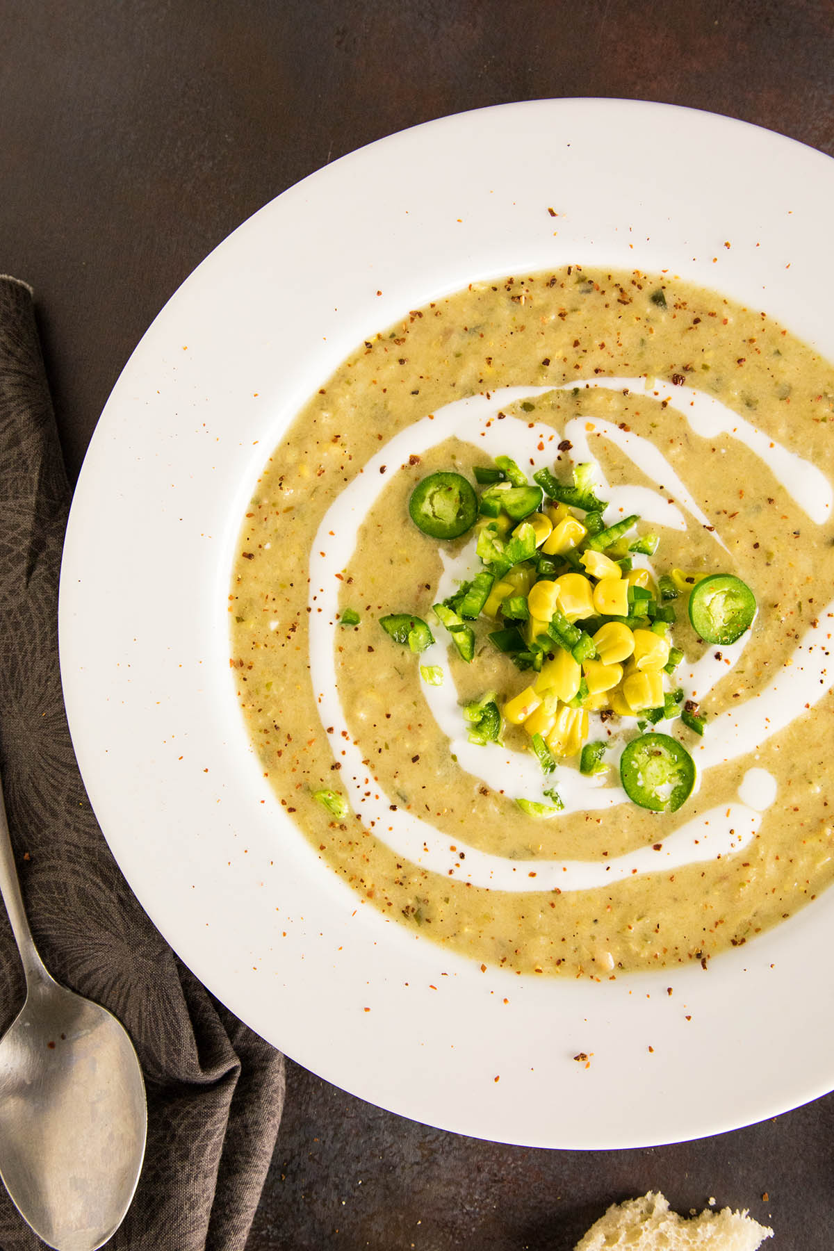 Sweet Pepper-Sweet Corn Chowder with a spoon on the side.