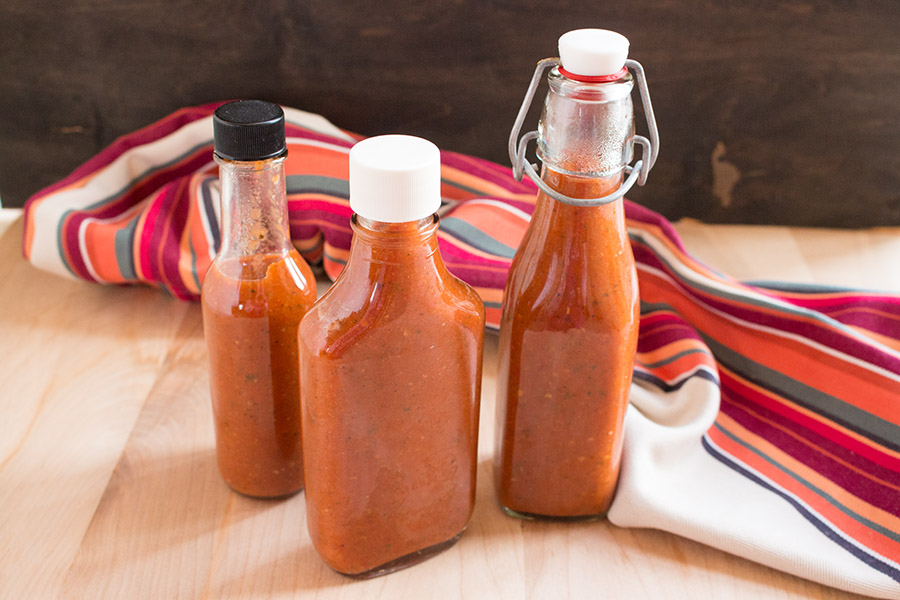 Three bottles of the homemade Sweet and Savory Chili Sauce