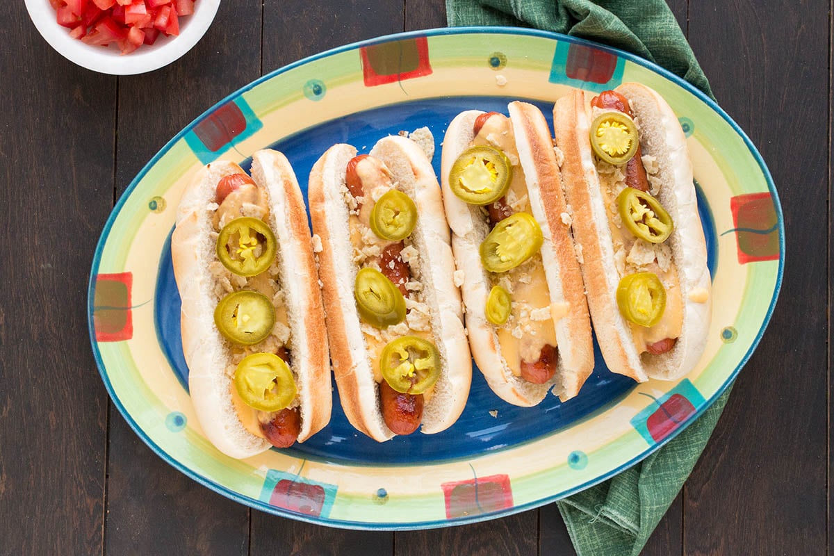 The Ultimate Summer Nacho Dog on a plate.