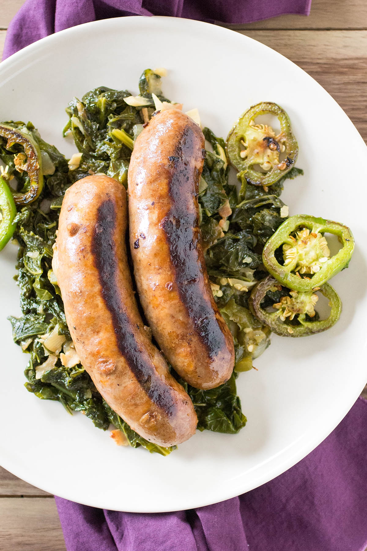 seared sausages with mustard greens and peppers