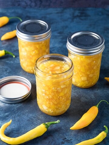 Pineapple-Mango-Hot Pepper Jam served in three jars