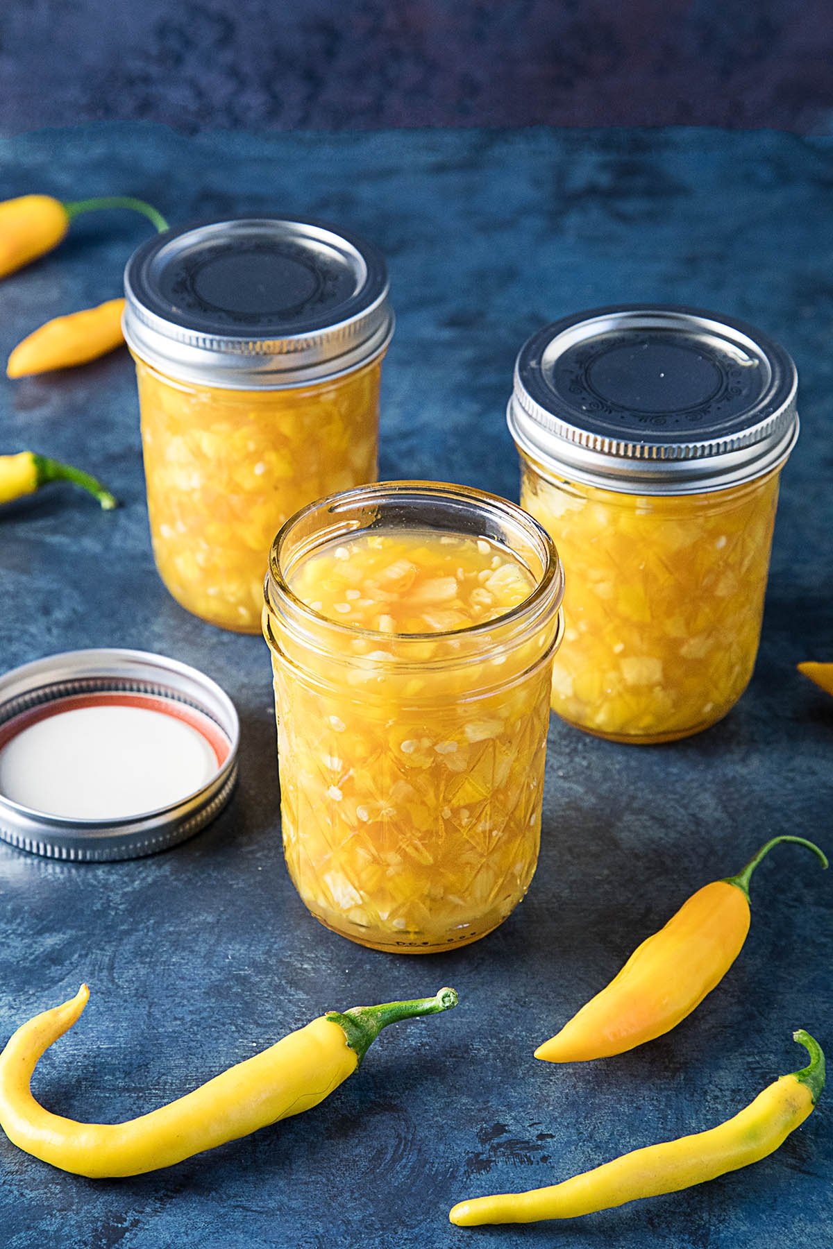 Pineapple-Mango-Hot Pepper Jam served in three jars