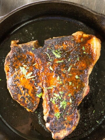 Ancho Crusted Porterhouse Steak in a skillet