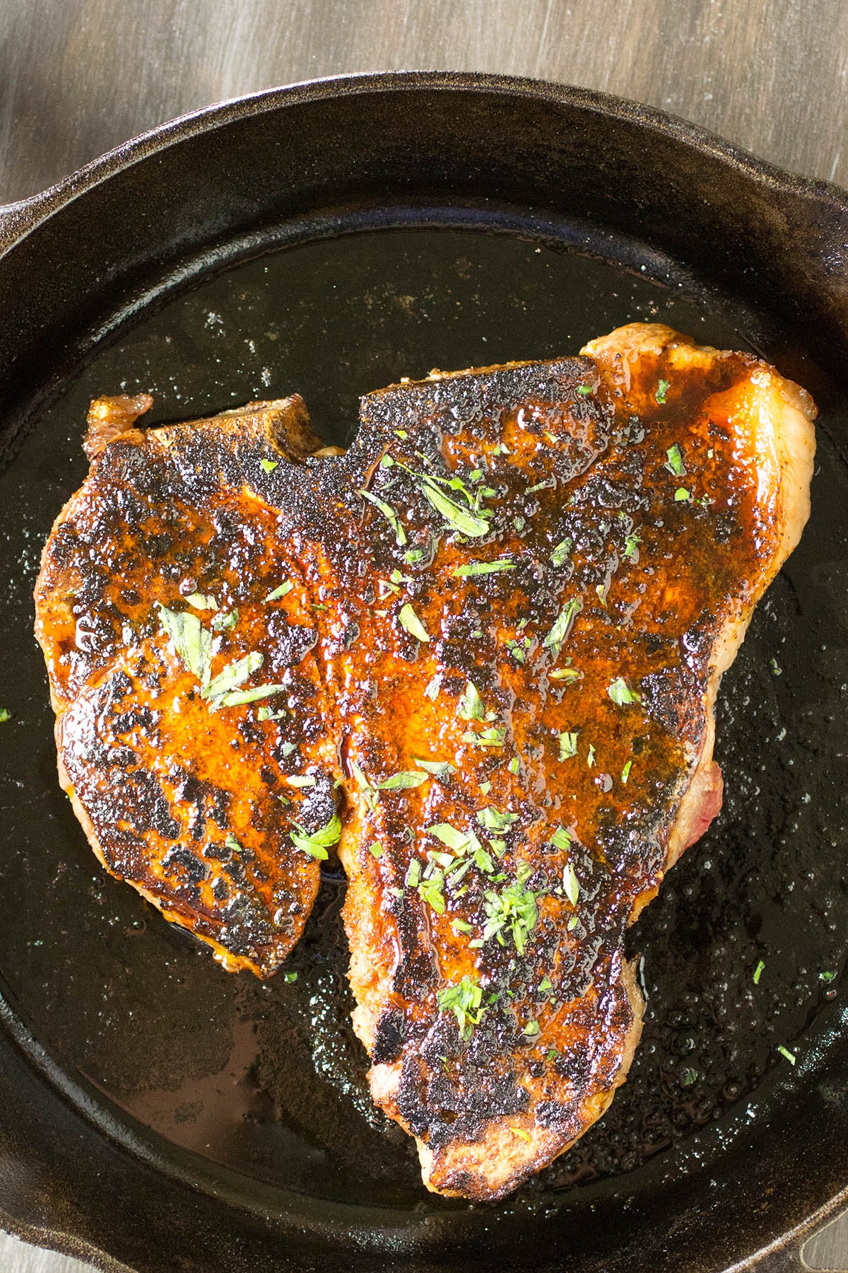 Ancho Crusted Porterhouse Steak in a skillet