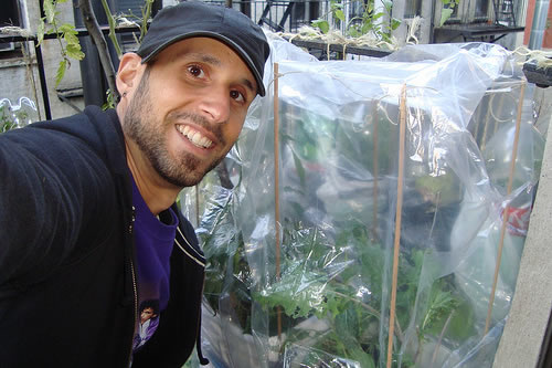 Mike Lieberman in front of the pepper garden.