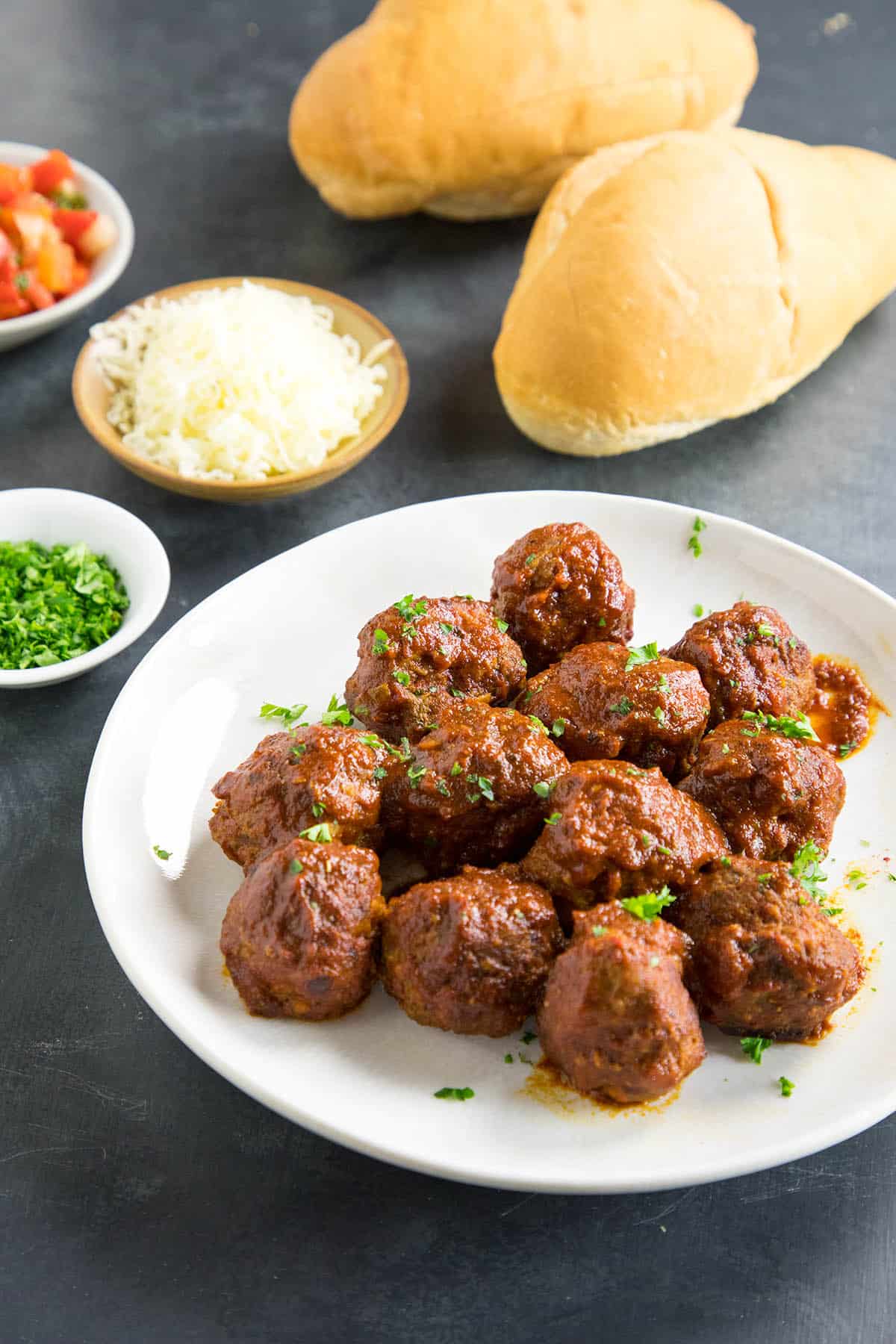 Serving Spicy Meatballs in Chipotle-Lime Sauce on buns for a meatball sub sandwich.
