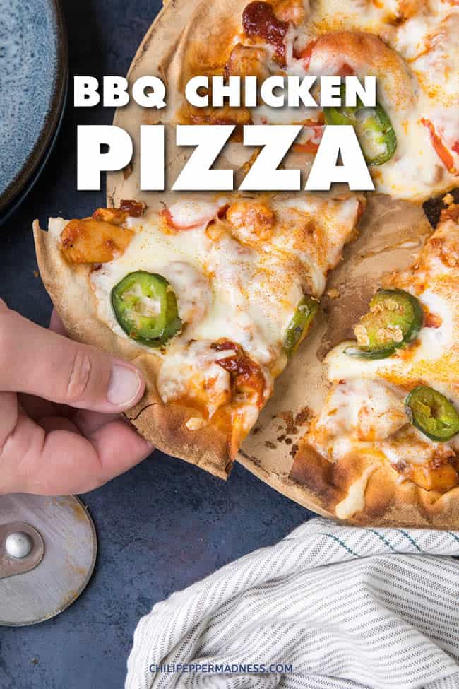 This bbq chicken pizza is loaded with seasoned chicken, melty mozzarella cheese, barbecue sauce, roasted jalapenos, and spiced with just the right amount of heat and flavor. A spicy food lover’s dream. | ChiliPepperMadness.com #Pizza #Dinner #BBQPizza #ComfortFood