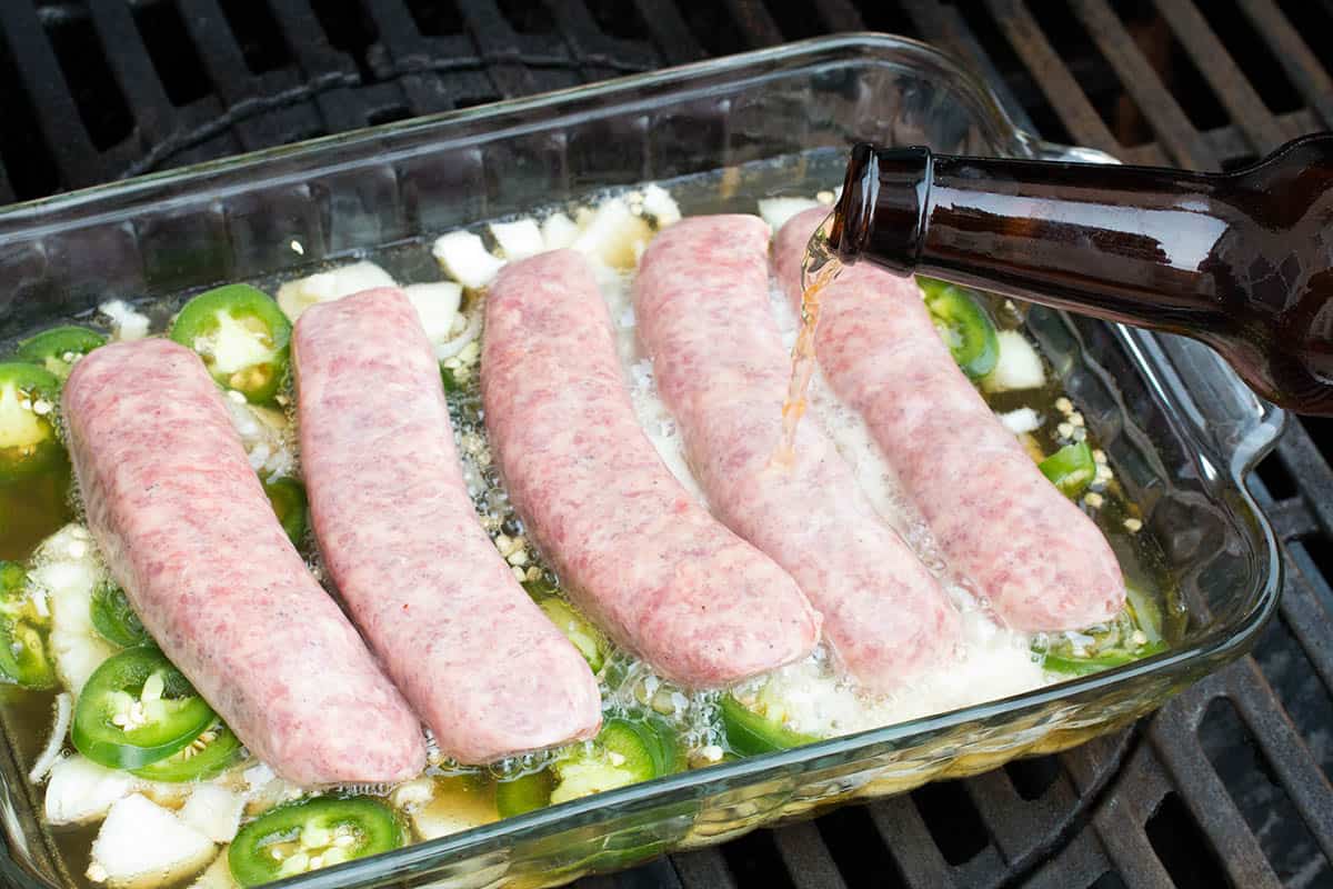 How to Make Beer Brats - Layer the Sausages and Cover in Beer