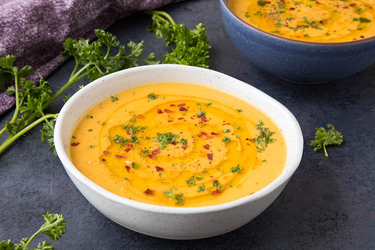 30-Minute Sweet Potato Soup with Cajun Seasonings, Sprinkled with Chili Flakes and Drizzled with Olive Oil