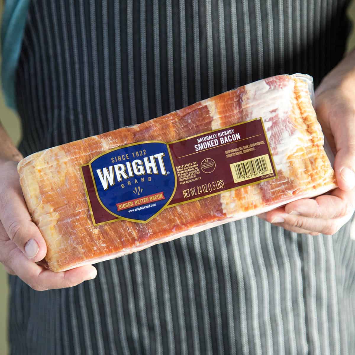Wright Brand Bacon in hands.