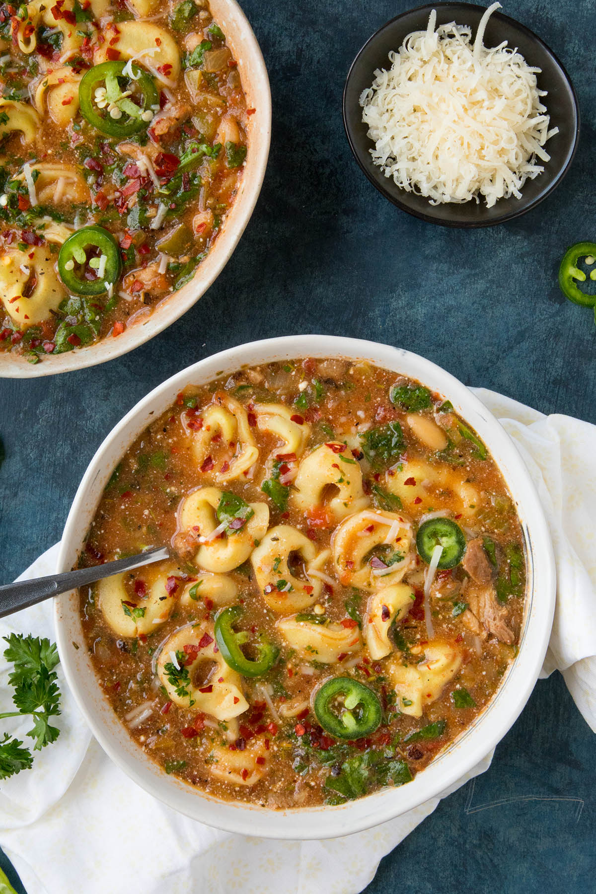 Zesty Chicken Tortellini Soup Sprikled with Spicy Chili Flakes