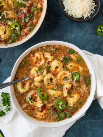 Zesty Chicken Tortellini Soup Sprikled with Spicy Chili Flakes
