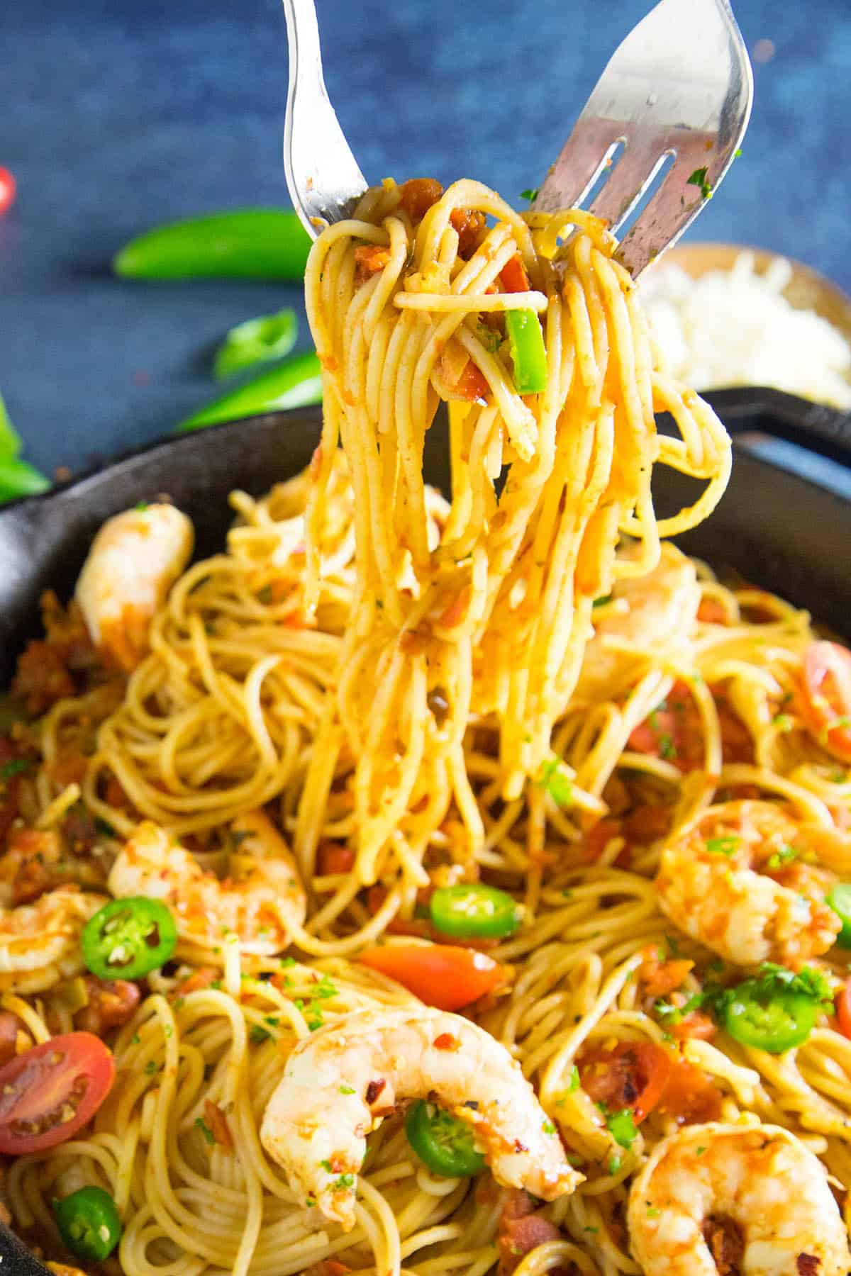 Twirling pasta with a fork.