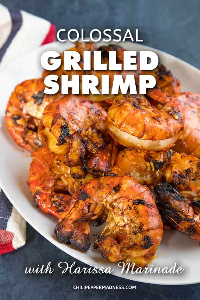 Colossal Grilled Shrimp with Harissa Marinade - Get your grills ready for this recipe of very large succulent shrimp that have been marinated in flavorful harissa, then grilled to perfection. They're super tender and huge on flavor. #Shrimp #GrilledShrimp #Grilling #SummerFood #Seafood #Dinner #Harissa #Shellfish #SpicyFood #Spicy