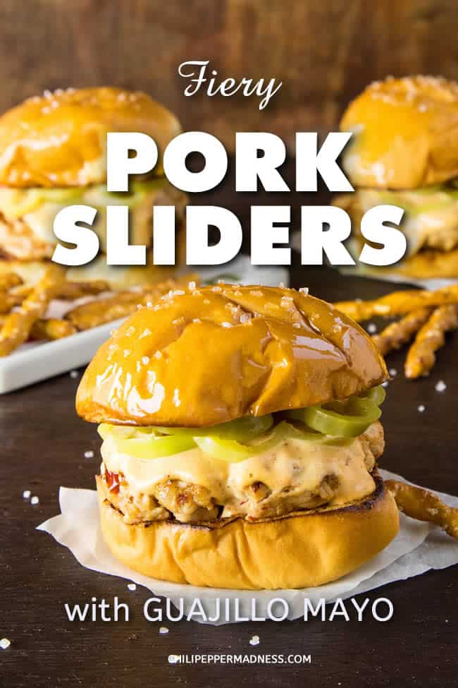Fiery Pork Sliders with Guajillo Mayo - This recipe for pork sliders is truly FIERY with ghost peppers added to the pork. They're grilled or seared then topped with an easy-to-make, flavorful guajillo mayo and quickly pickled peppers. #burgers #sliders #PorkSliders #Pork #Guajillo #GhostPeppers