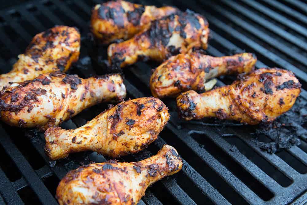 Grilled Harissa Chicken Legs On the Grill, Cooking, Nicely Charred