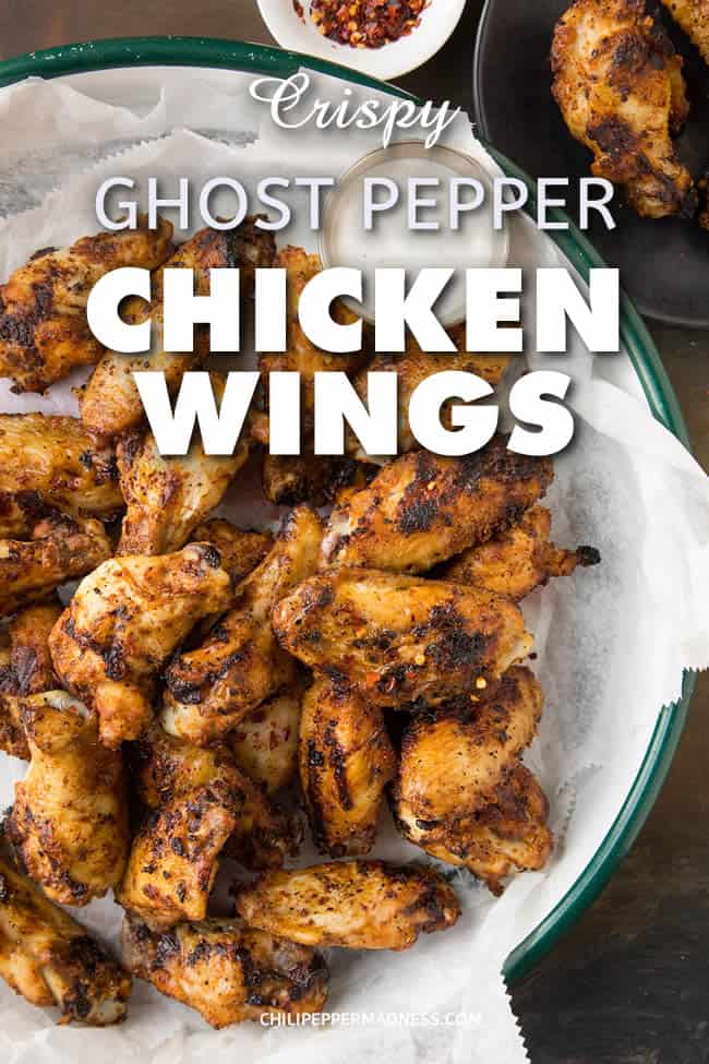 Crispy Grilled Ghost Pepper Chicken Wings - A recipe for spicy grilled ghost pepper chicken wings that have been rubbed down with a vibrant mix of ghost pepper flakes and other seasonings, then grilled to crispy perfection. Fire up those grills and get cooking. For true spicy food lovers. #Dinner #Wings #ChickenWings #Grilling #GhostPeppers #Spicy #ExtraSpicy
