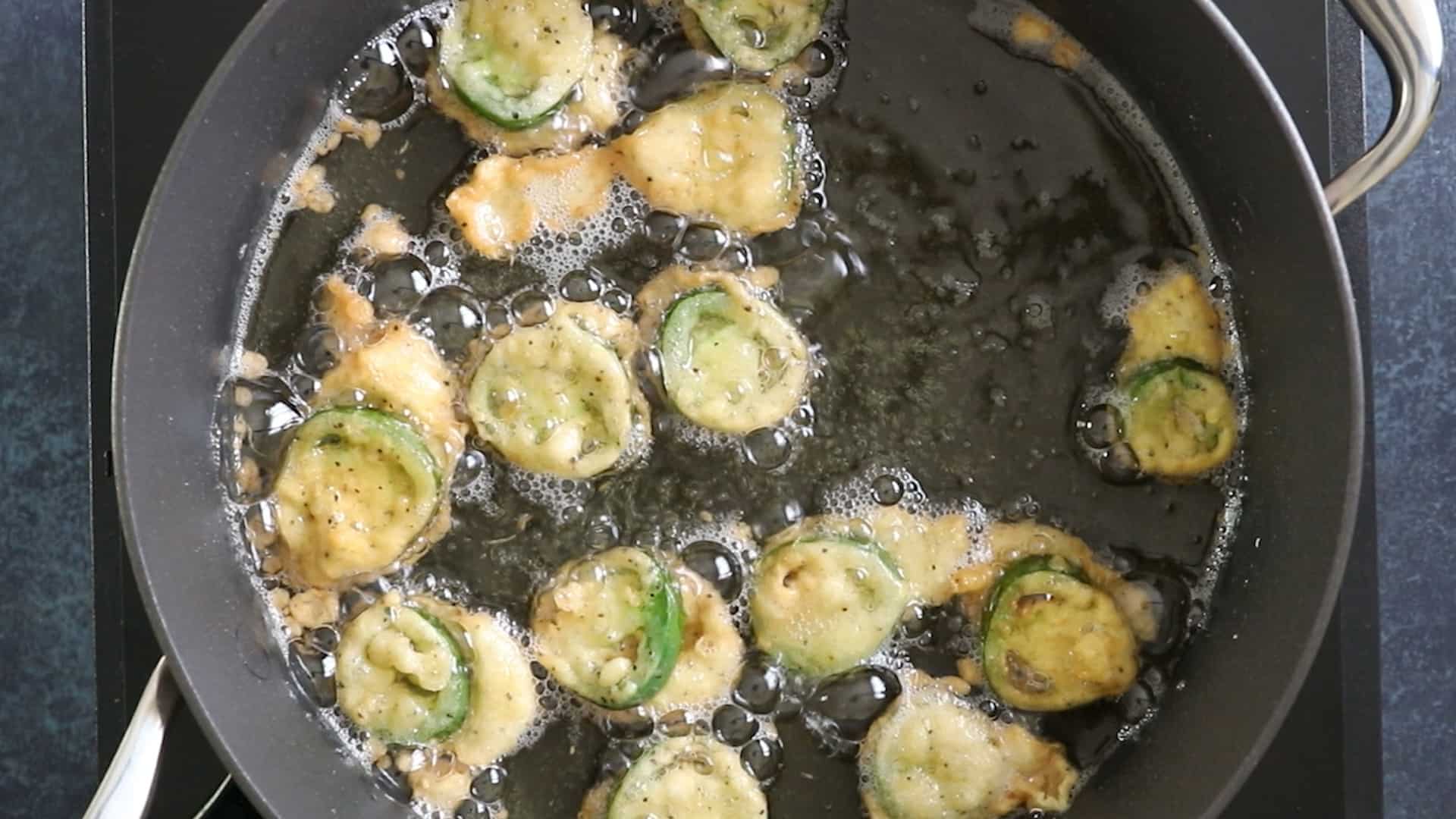 Frying the battered jalapeno peppers (aka jalapeno bottle caps)