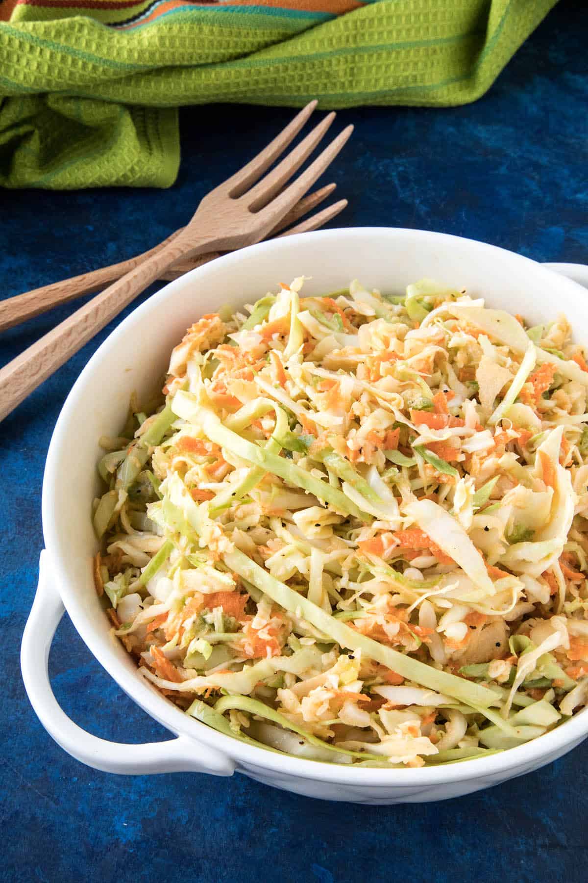 This Spicy Creamy Coleslaw is made with shredded cabbage, carrots, onion and jalapeno, then tossed with a creamy, spicy dressing