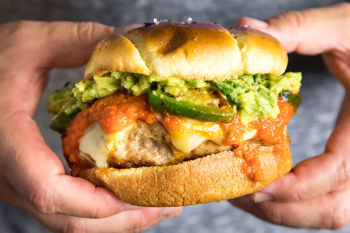 Holding the Guacamole Turkey Burger in two hands