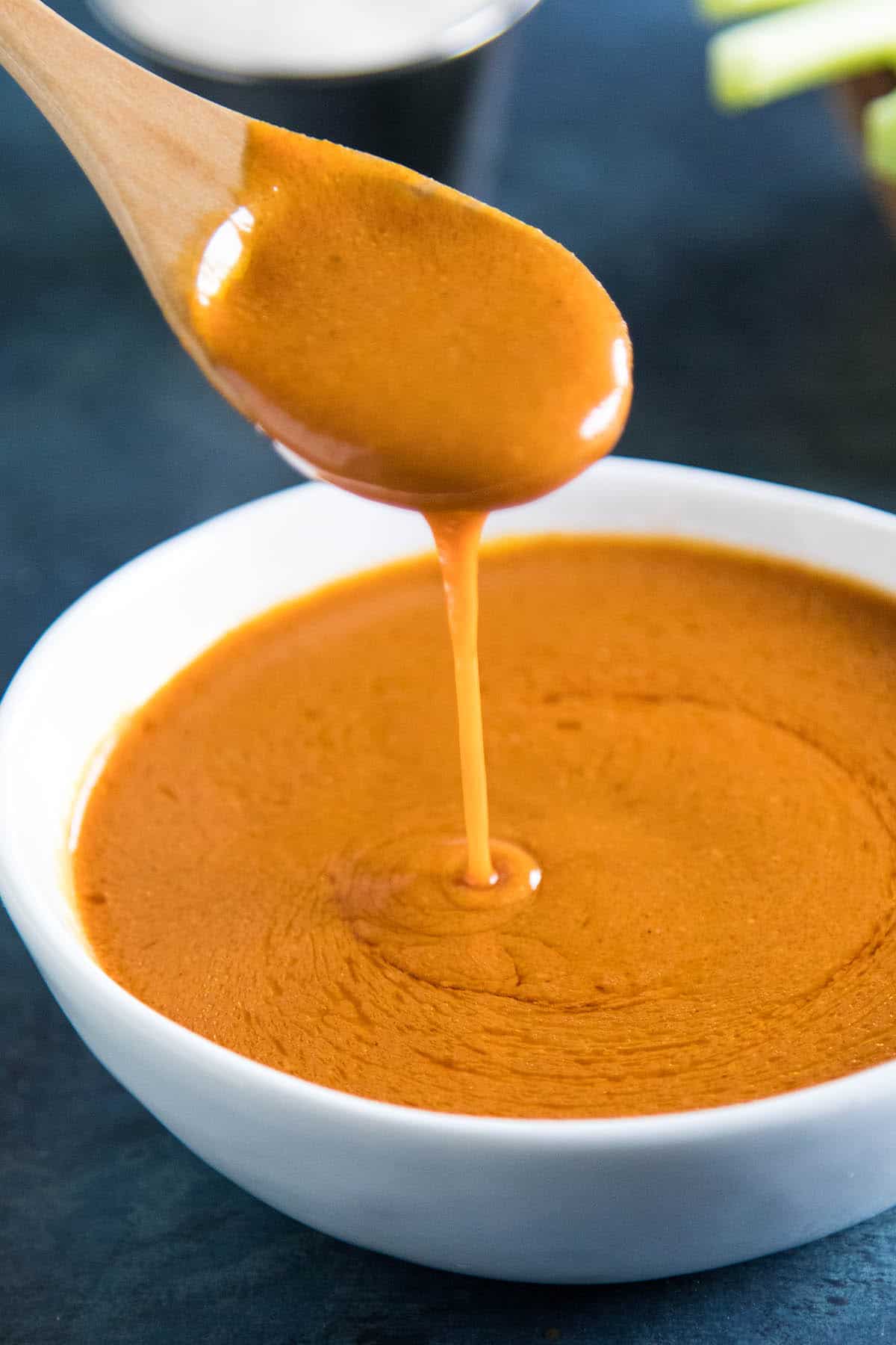 A spoonful of the delicious homemade buffalo sauce.