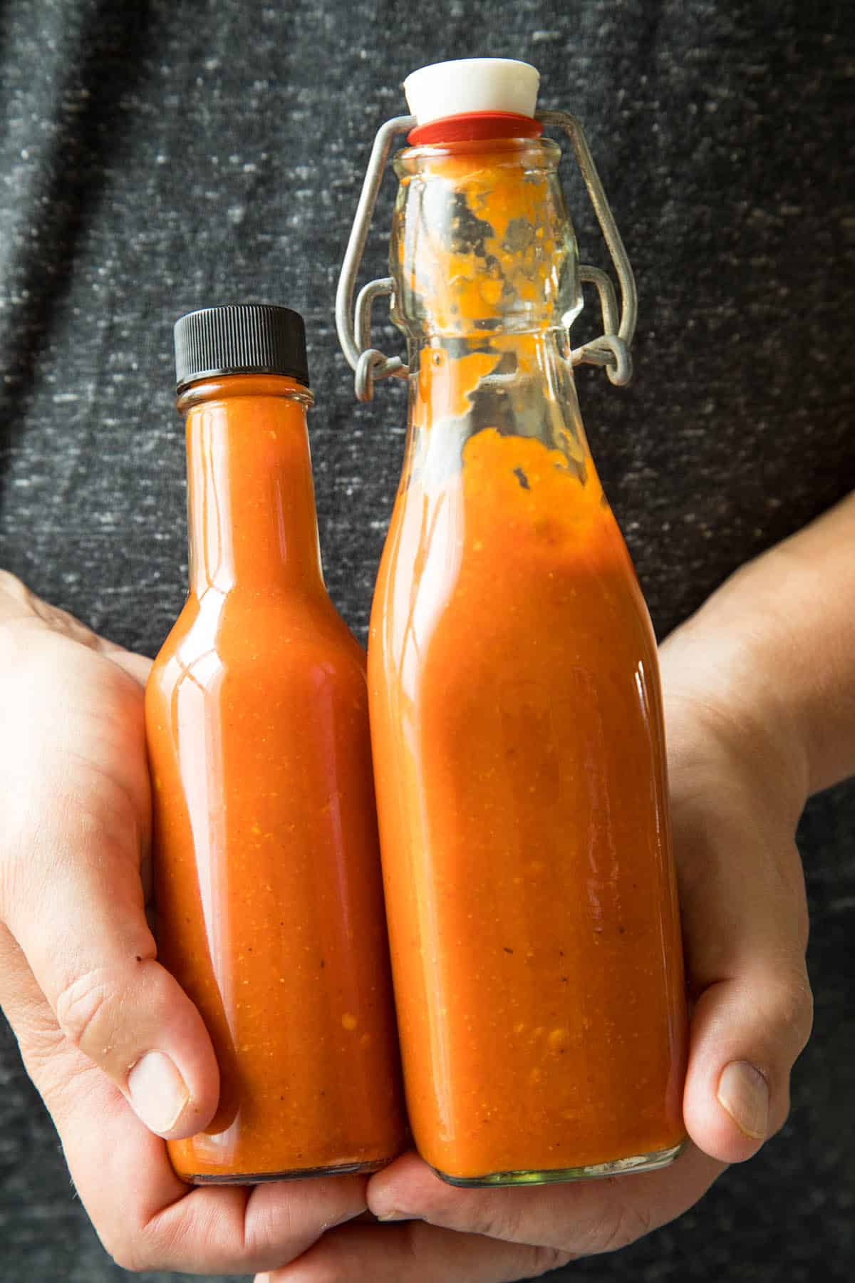 Roasted Red Jalapeno Pepper Hot Sauce in two different bottles