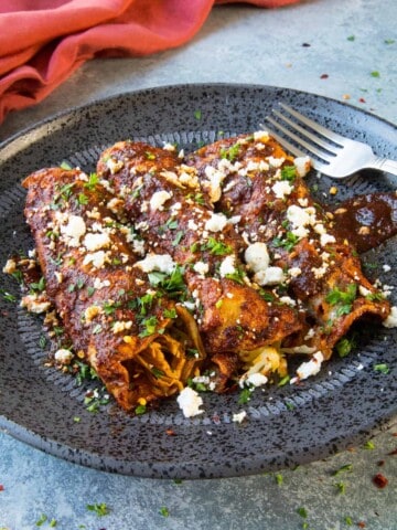 Chicken Enchiladas Rojas served on a plate