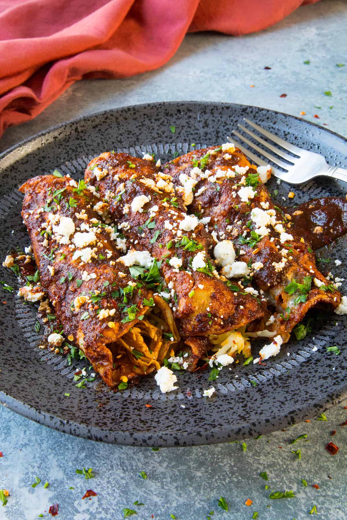 Chicken Enchiladas Rojas served on a plate