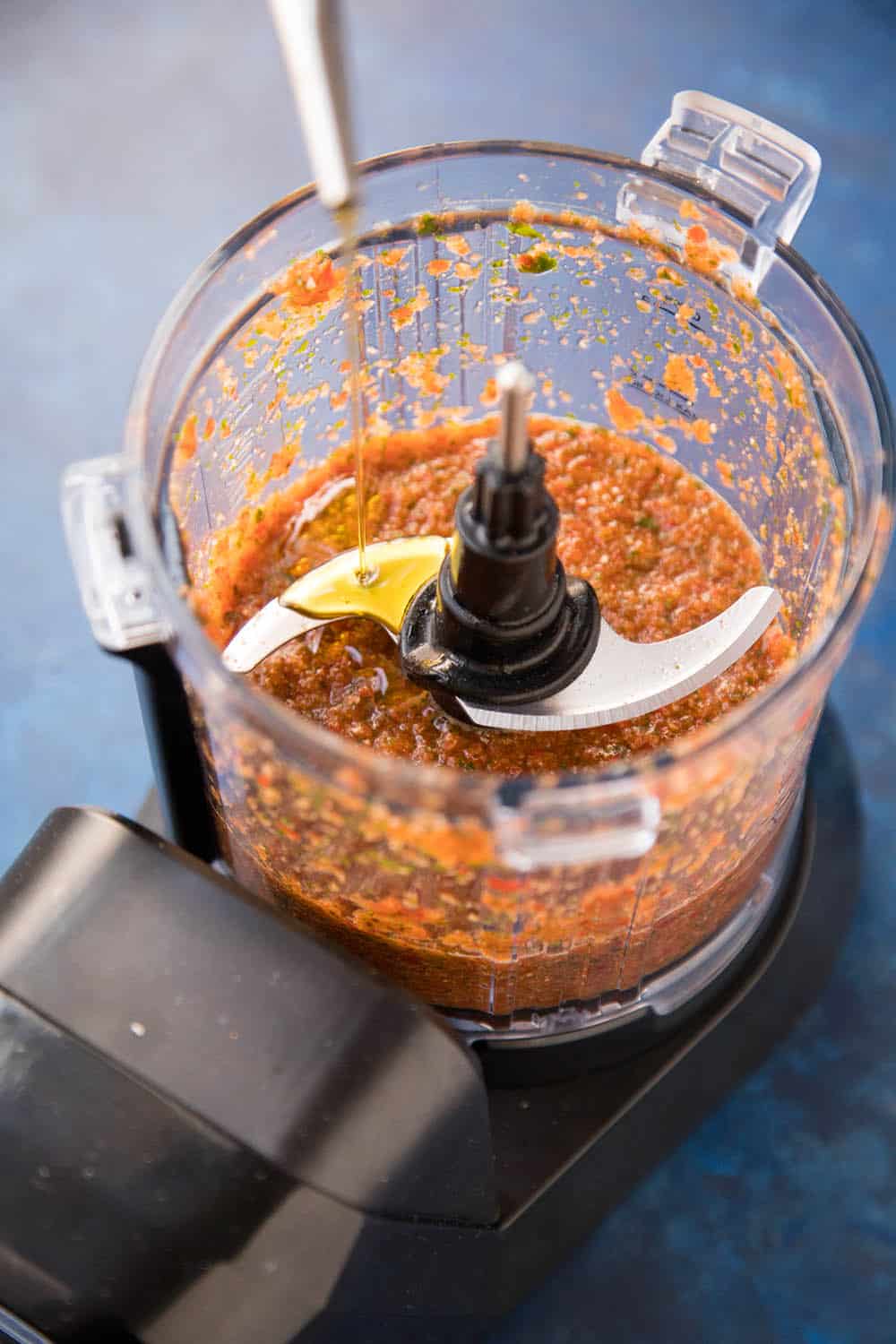 Peri Peri Sauce in a blender, adding olive oil