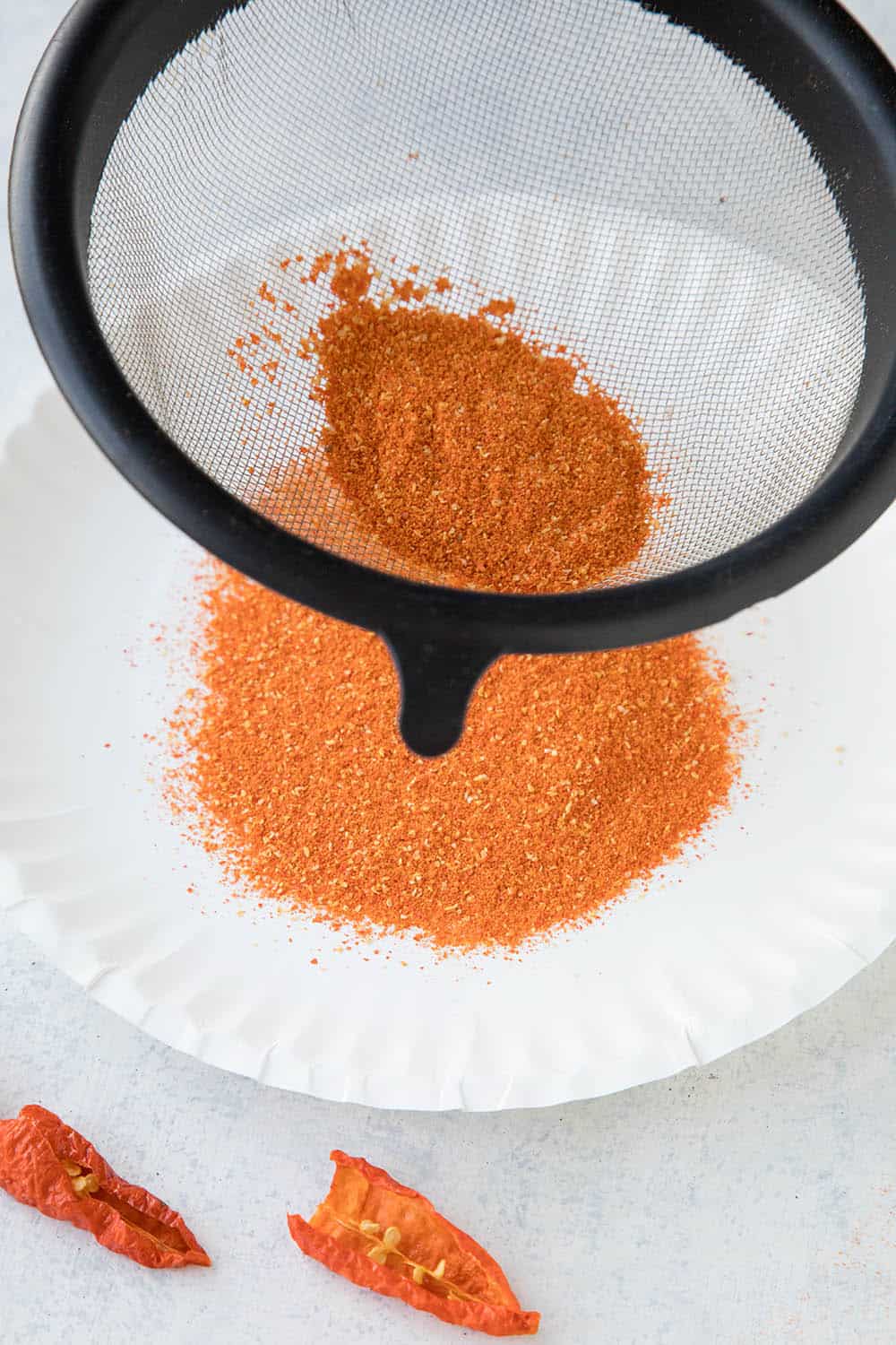 Sifting Ground Ghost Pepper Powder.