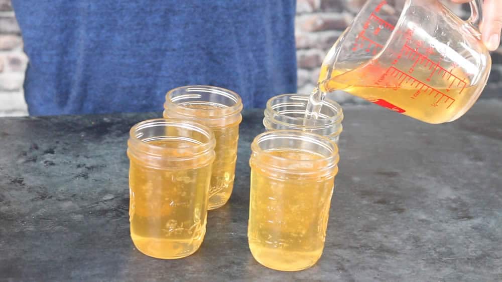 Pouring the Jalapeno Jelly into jars