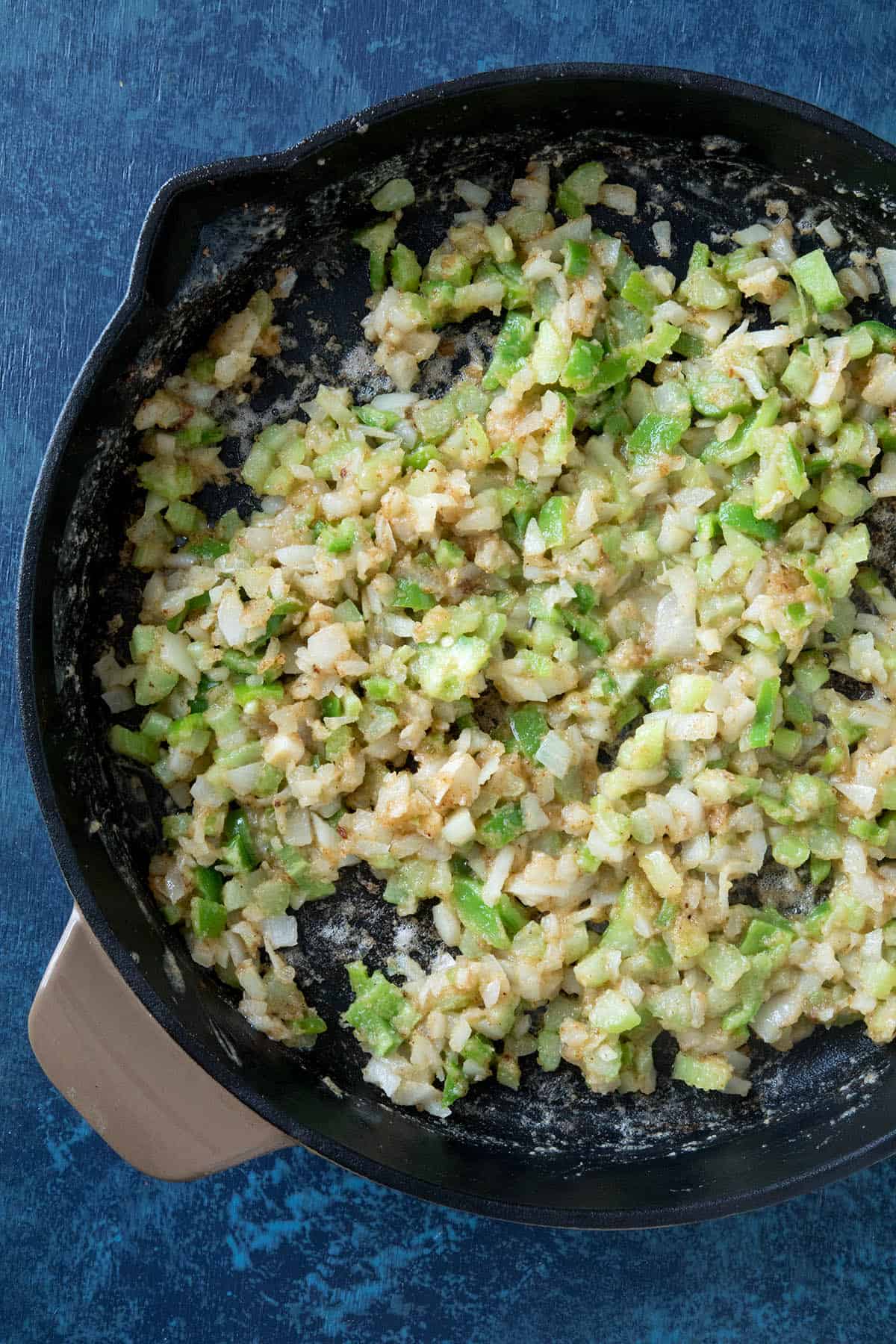 Add the celery, peppers and onion to the pan.