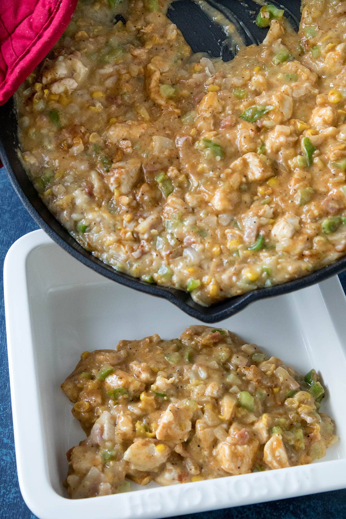 Pour the Cajun Chicken Casserole into a baking dish.