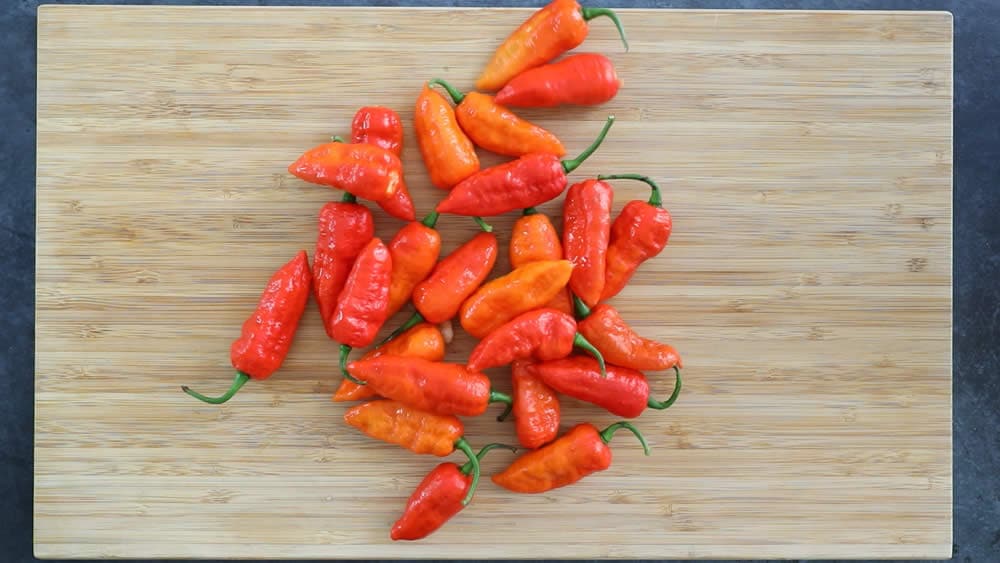 Ghost Peppers on a wooden board