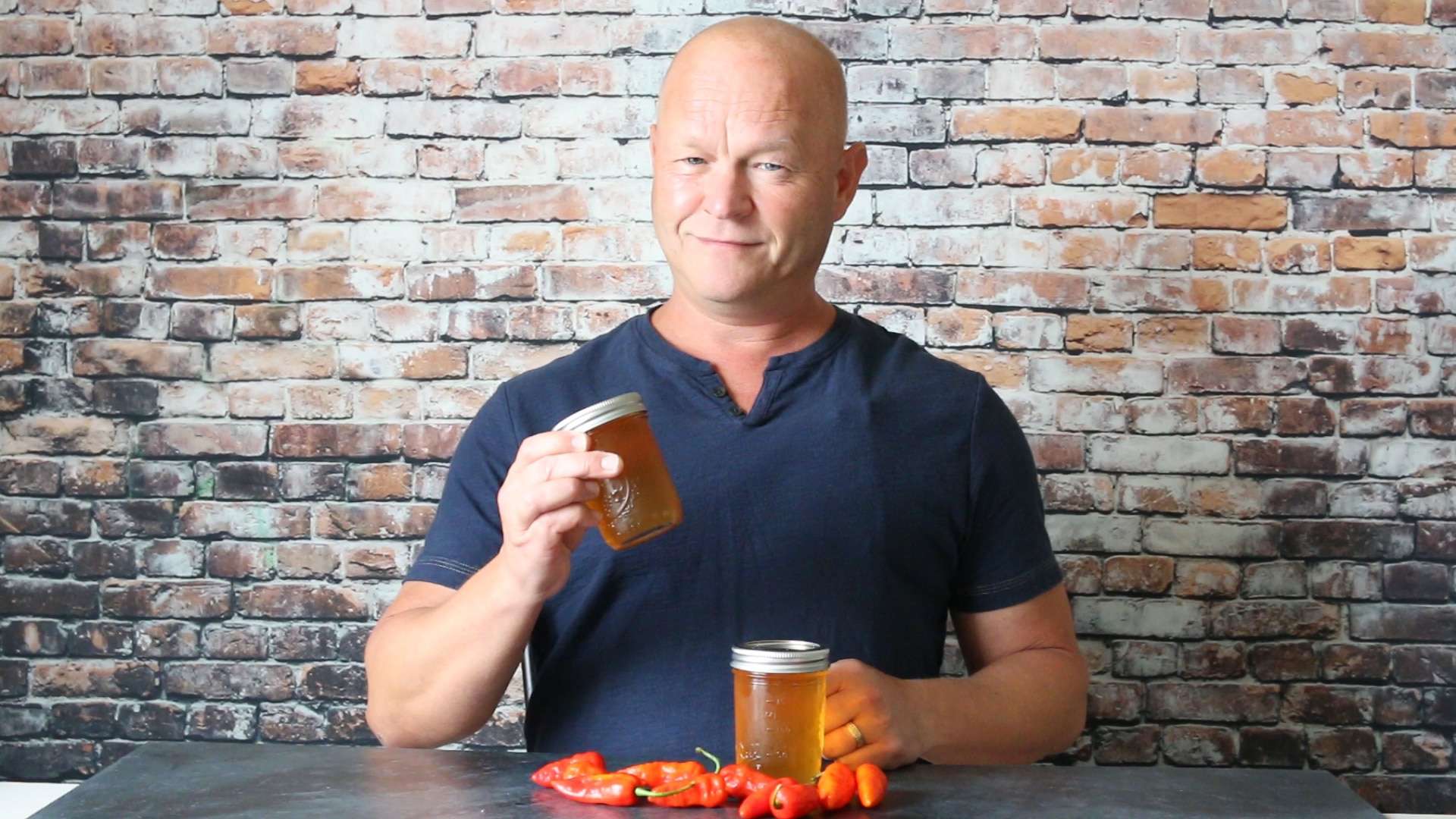 Mike holding his newly made ghost pepper jelly