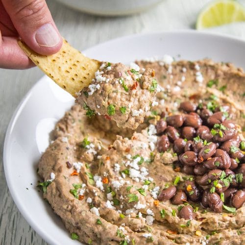 A big scoop of Black Bean Dip on a tortilla chip