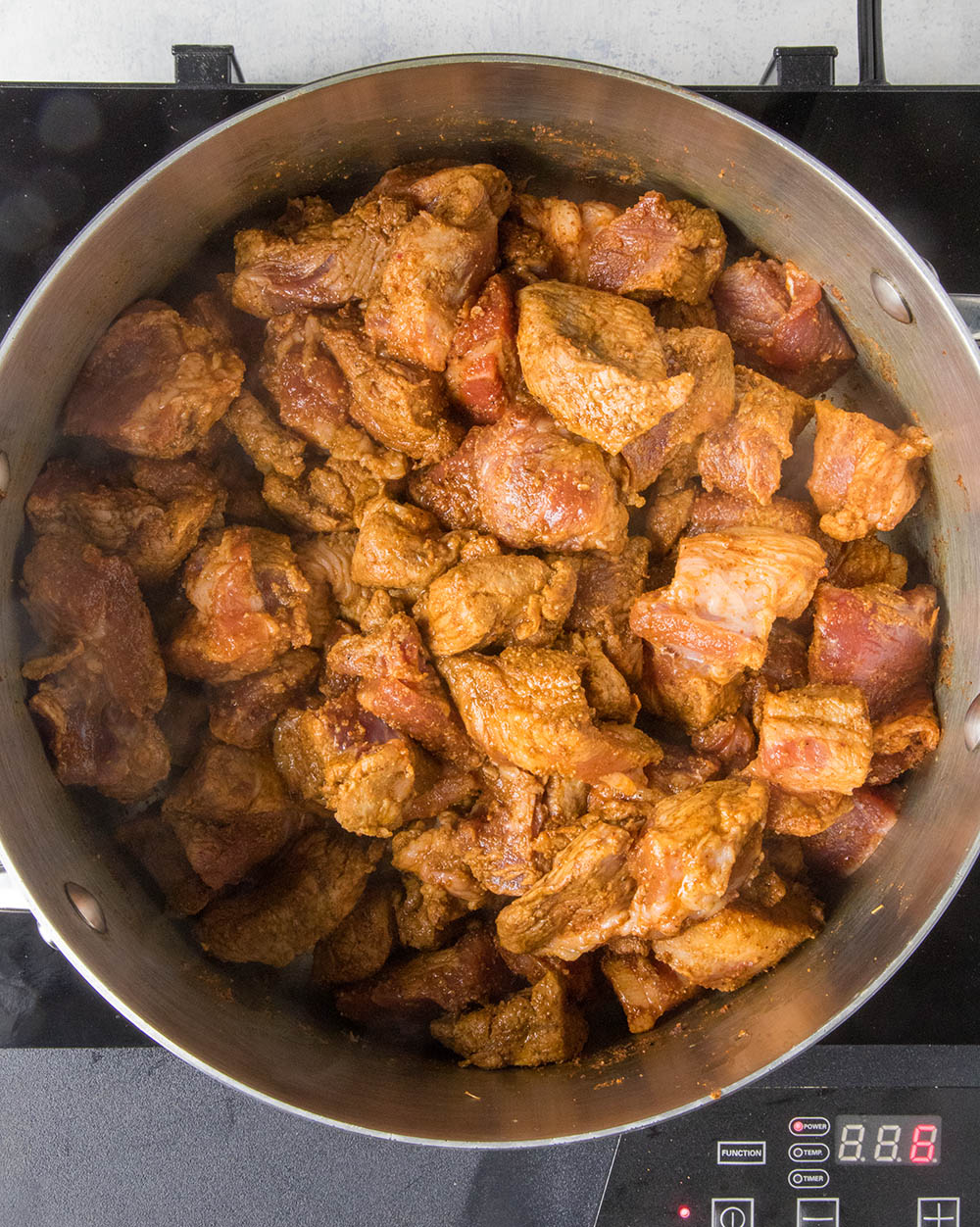 Cubed pork shoulder, browned in the pot