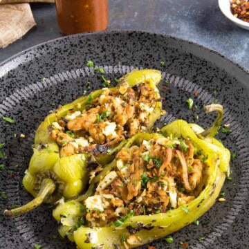Chicken and Cheese Stuffed Anaheim Peppers - Served, with hot sauce