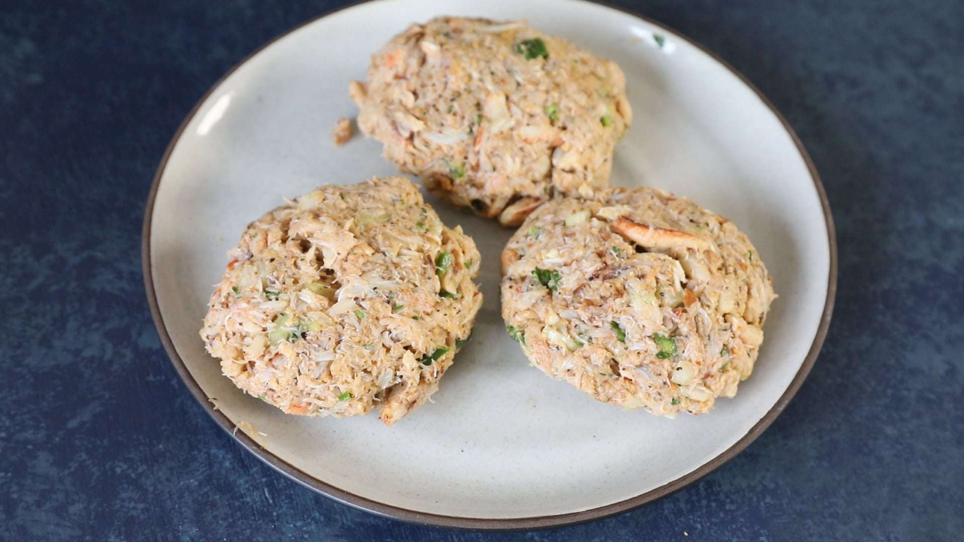 Hand formed crab cakes, ready to cook