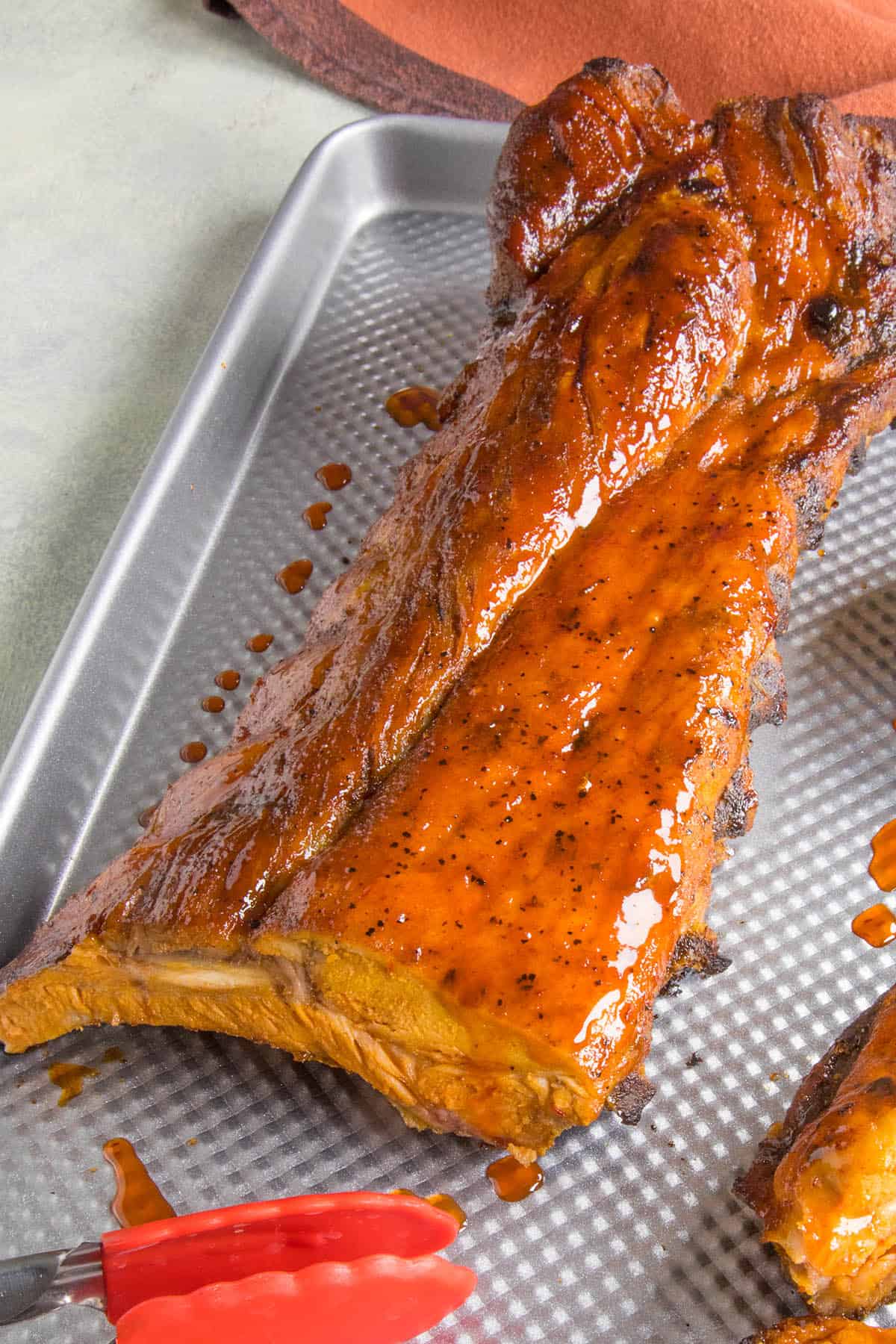 Oven Baked Ribs on a pan with extra glazing.