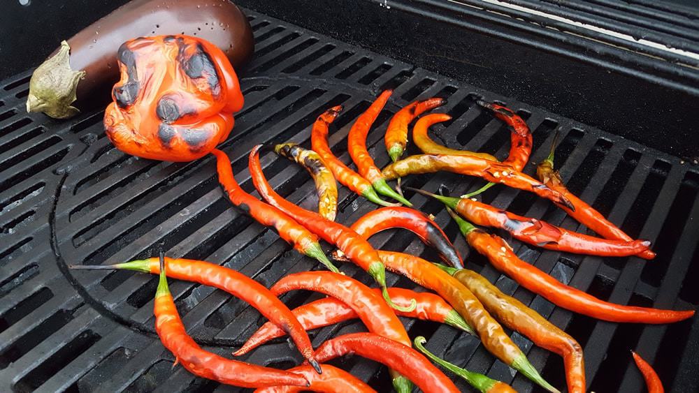 Roasting peppers and eggplant to make Ajvar