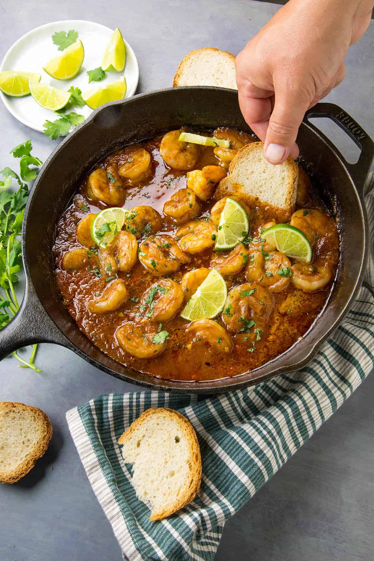 Dipping crusty bread into my Shrimp in Fiery Chipotle-Tequila Sauce to sop up the sauce