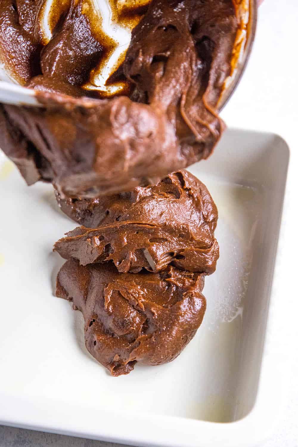 Pouring the batter in a pan to make Mexican Brownies