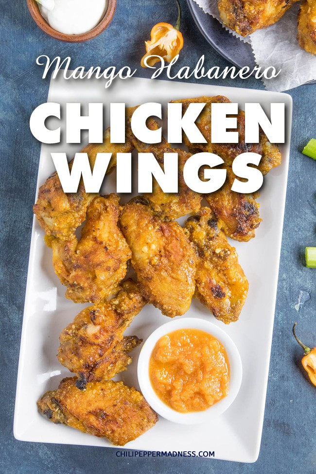 Mango Habanero Chicken Wings - These sweet and spicy chicken wings are tossed with a homemade mango-habanero sauce that you can whip together in no time. Here is the recipe. #ChickenWings #HotWings #Habanero