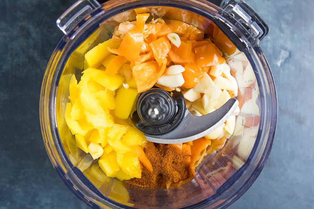 Ingredients for our mango-habanero sauce in a food processor
