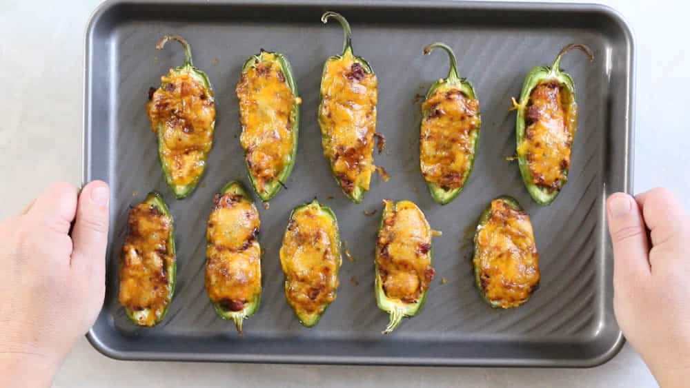 Pulled Pork-Sriracha Jalapeno Poppers on a baking sheet, fresh out of the oven