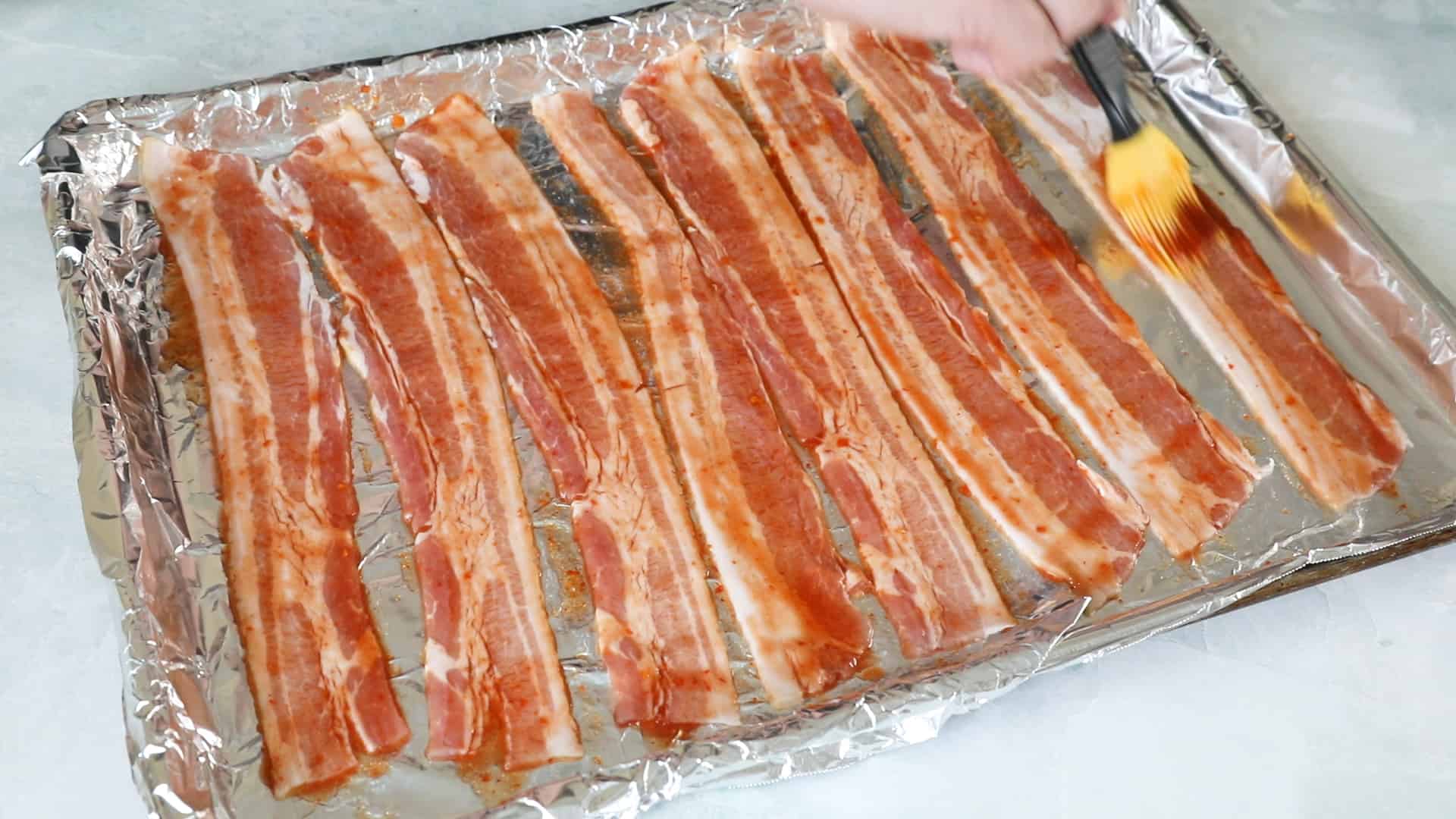 Rub down the bacon with your spicy ghost pepper mixture
