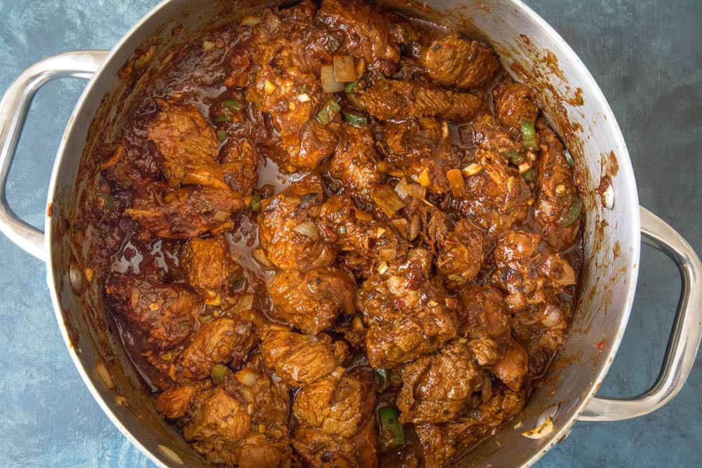 Chili Con Carne - Recipe Add the chili sauce to the browned meat for making chili con carne