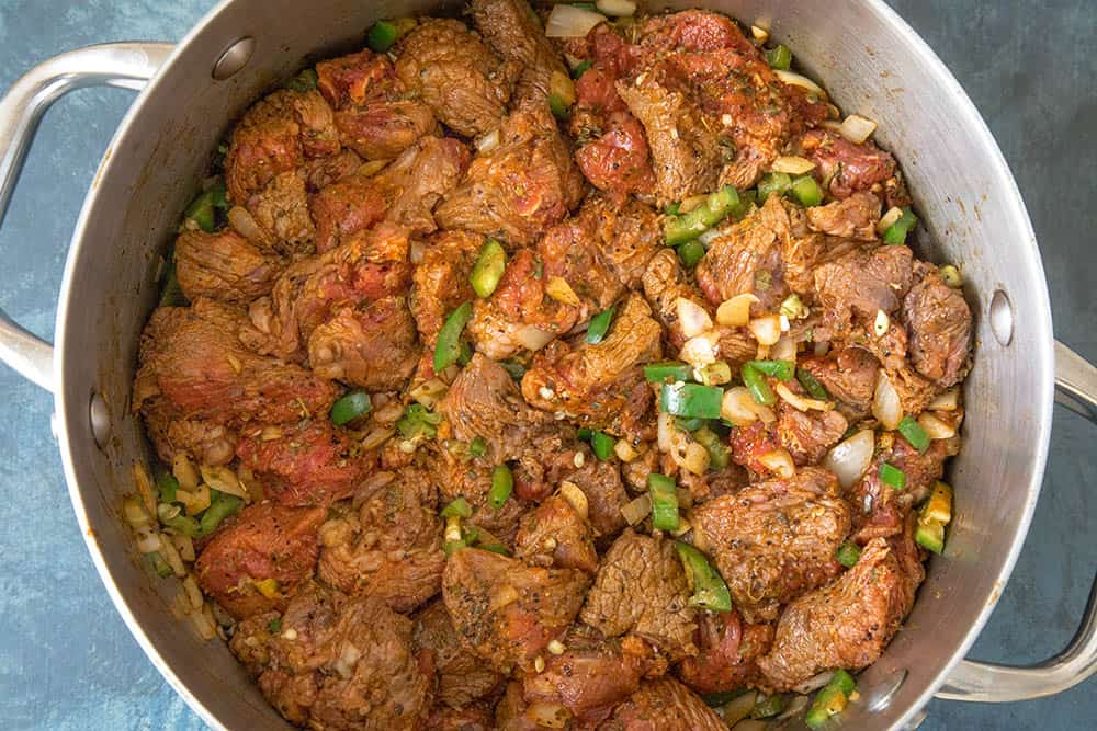 Chili Con Carne - Recipe Brown the seasoned cubed beef along with peppers and onions