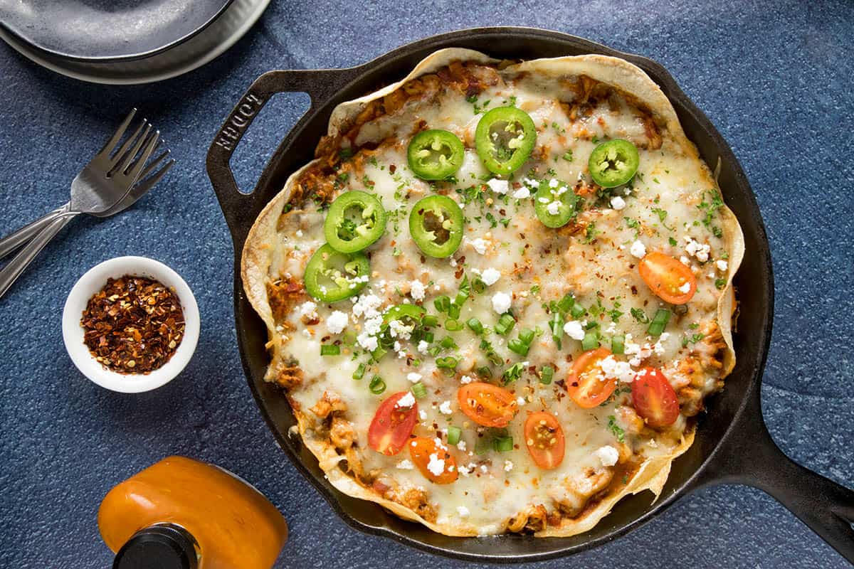 Chipotle Chicken Enchilada Casserole in a pan, ready to eat